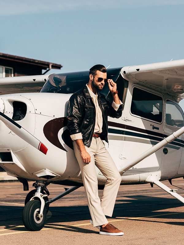 young-male-pilot-in-leather-jacket-and-sunglasses-6KCNVLW.jpg